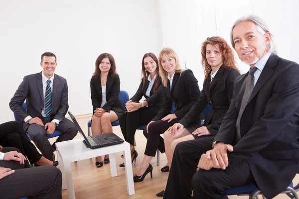 Group Of Business Sitting On Chairs — Stock Photo, Image
