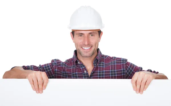 Man Wearing Hard Hat Holding Placard — Stock Photo, Image