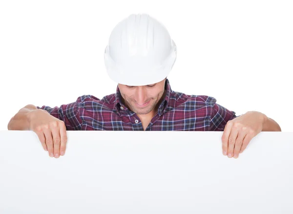 Man Wearing Hard Hat Holding Placard — Stock Photo, Image