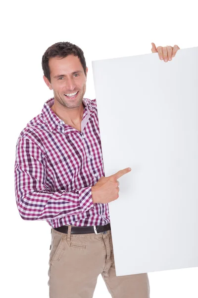 Retrato de homem jovem segurando Placard — Fotografia de Stock