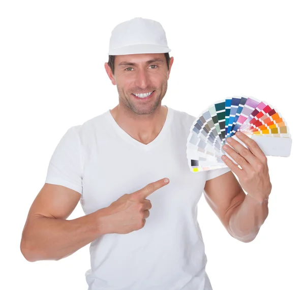 Painter Holding A Paint Roller And Spectrum Stock Photo