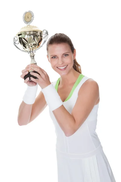 Jubilant winner holding up the trophy — Stock Photo, Image