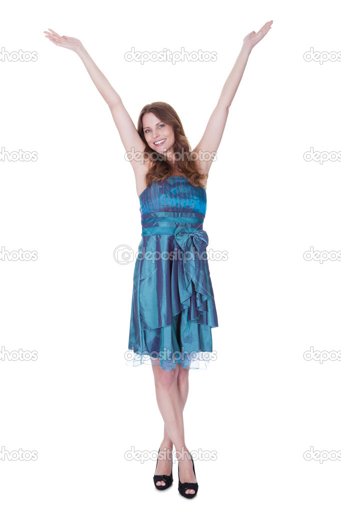 Cheerful woman with arms raised