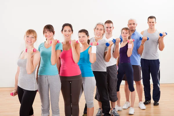 Aerobics class working out with dumbbells Royalty Free Stock Photos