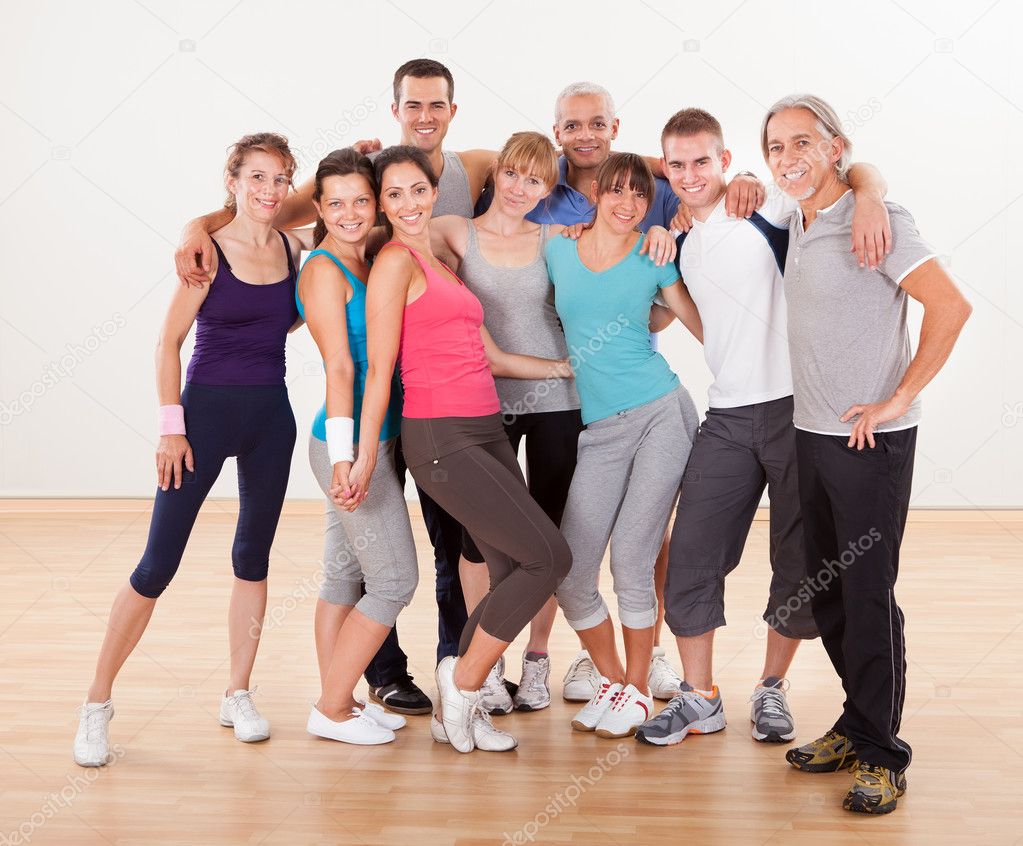 Group of friends posing at the gym