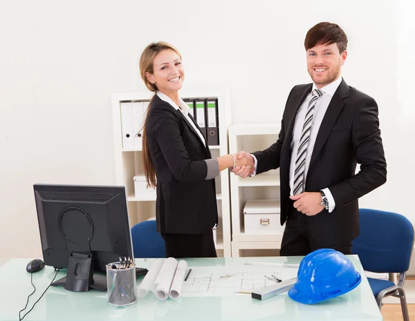 Architects shaking hands in the office — Stock Photo, Image