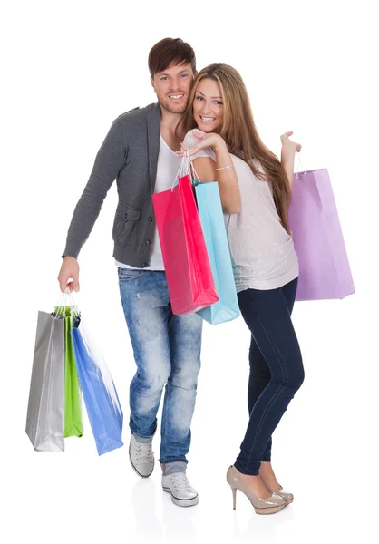 Guy and gal brings shopping bags Stock Photo