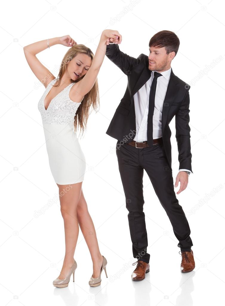 Young elegant couple dancing