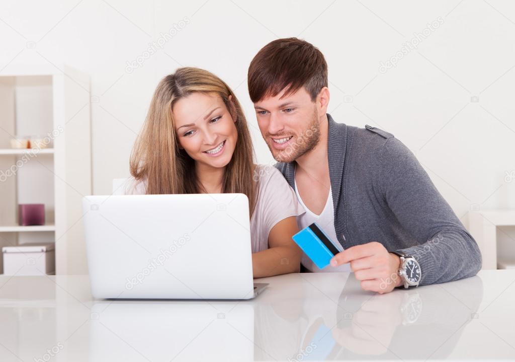 Couple shopping at online store
