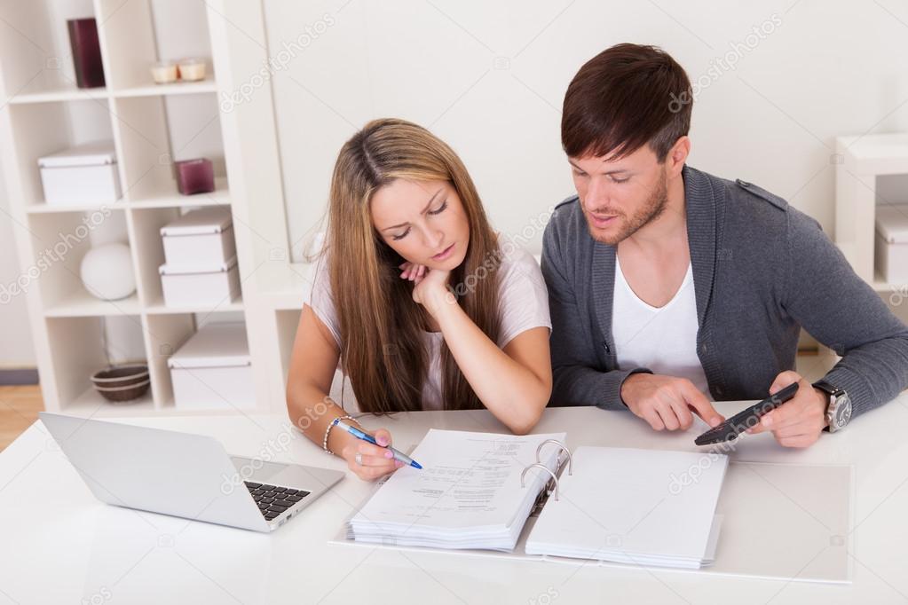 Unhappy young couple in financial trouble