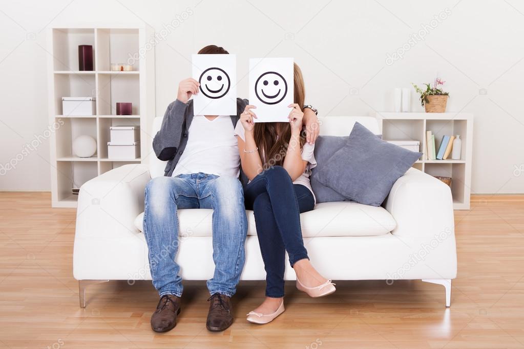 Couple covered faces