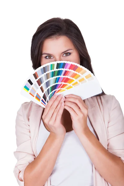 Attractive woman chooses a color scheme — Stock Photo, Image