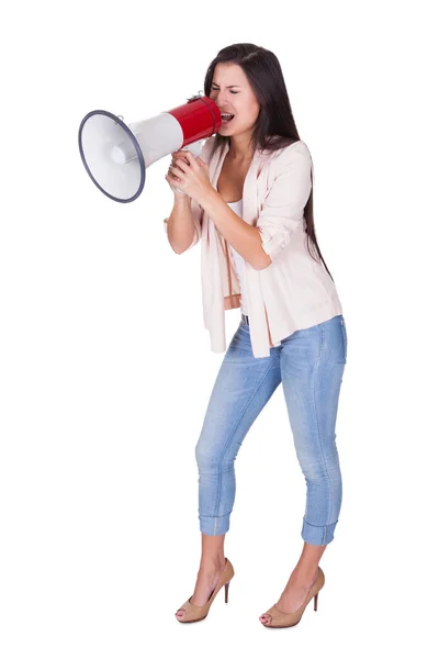 Woman shouting into a loud hailer — Stock Photo, Image