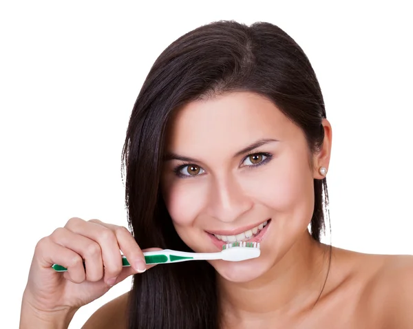 Beautiful woman brushing her teeth — Stock Photo, Image