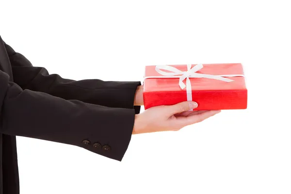 Woman holding out a gift Royalty Free Stock Photos