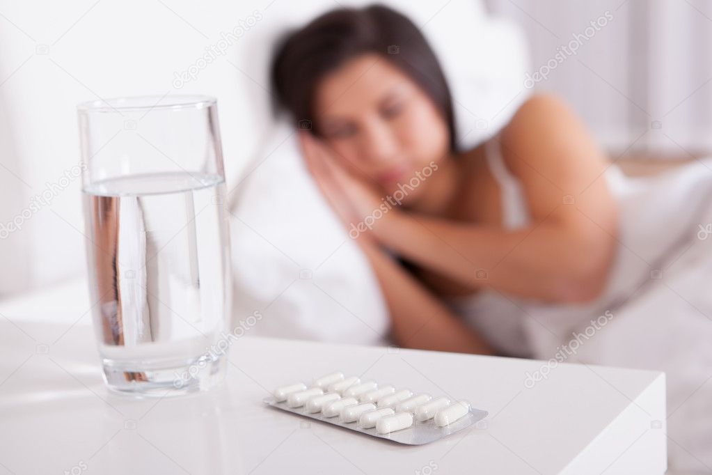 Sick woman resting in bed
