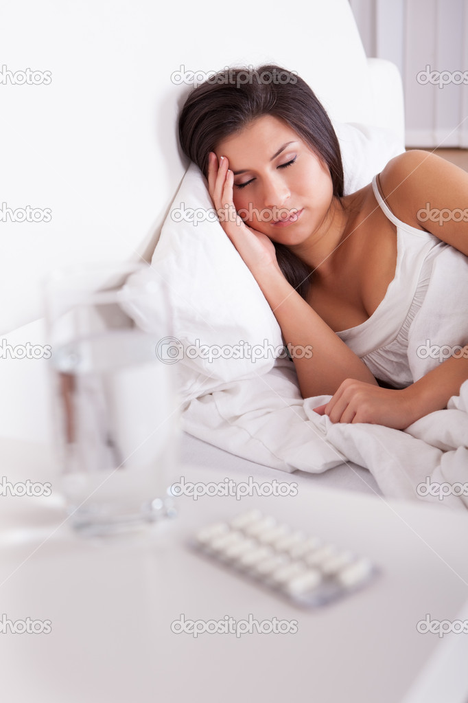 Ill woman sleeping in bed