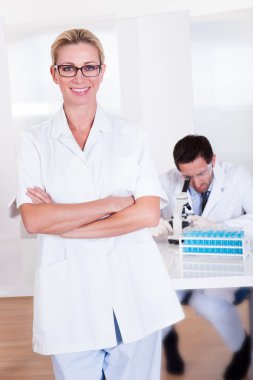 Lab technicians at work in a laboratory clipart