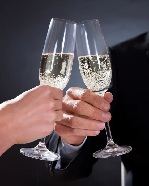 Romantic couple toasting each other — Stock Photo, Image