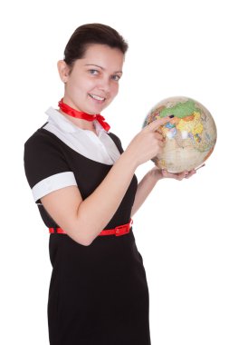 güzel hostes bir küre tutan