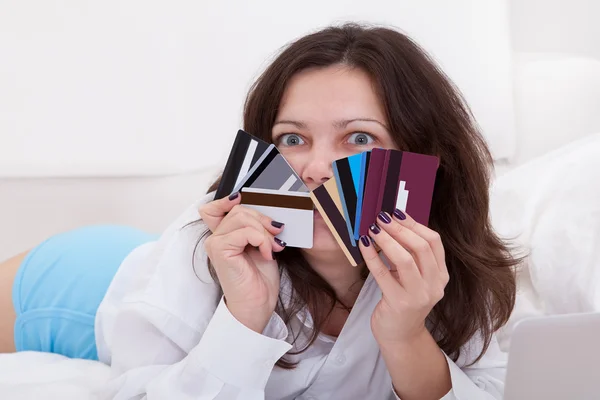 Woman with a fistful of credit cards — Stock Photo, Image