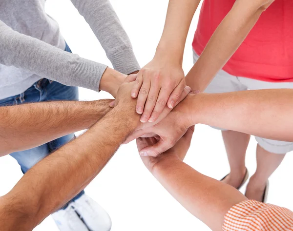 Four casual middle-aged friends holding hands Stock Photo