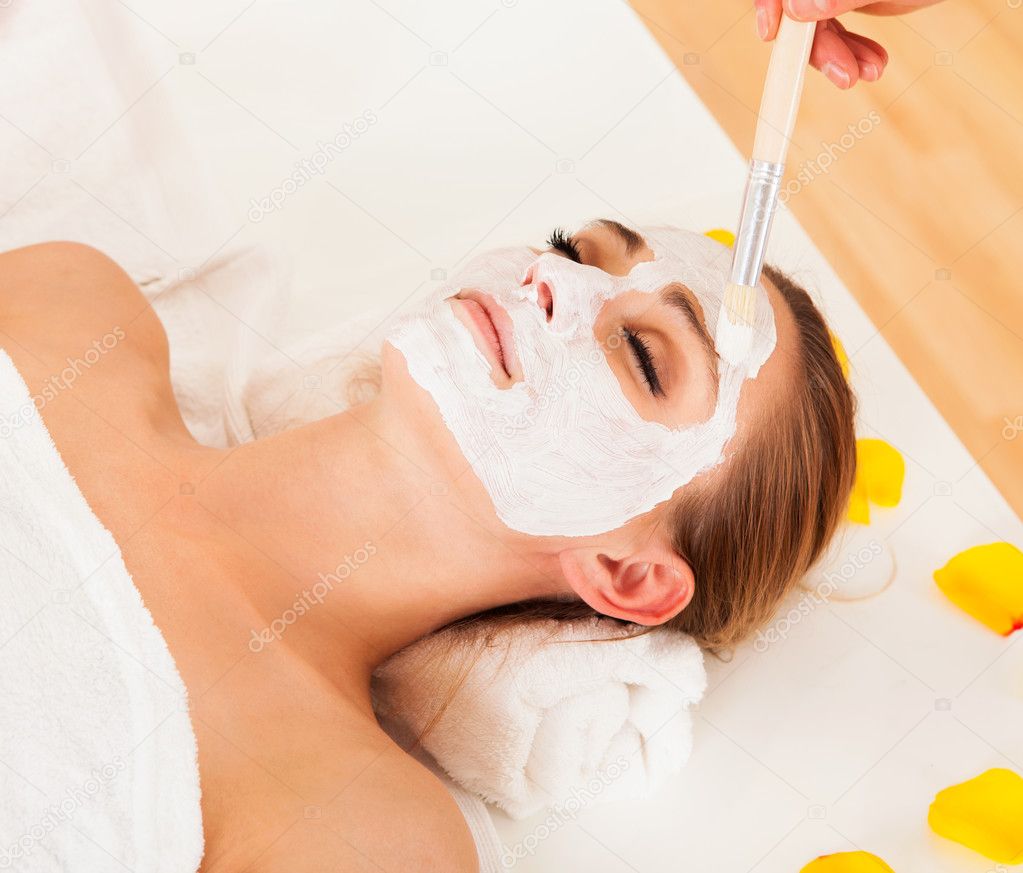 Therapist applying a face mask