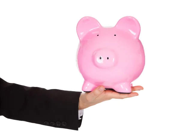 Businessman holding out a piggybank — Stock Photo, Image