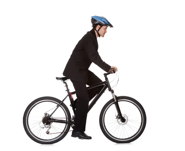 Empresário montando uma bicicleta — Fotografia de Stock