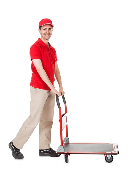 Deliveryman with a trolley of boxes — Stock Photo, Image