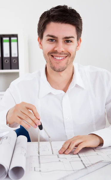 Architect working on blueprints — Stock Photo, Image