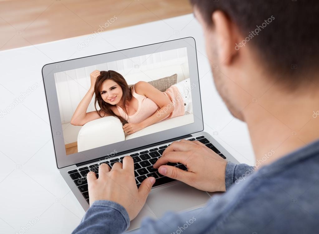 Man having a videochat with his girlfriend