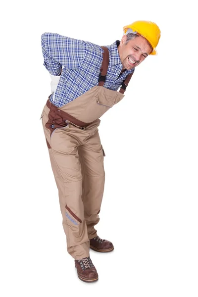Porträt eines Arbeiters mit Rückenschmerzen — Stockfoto