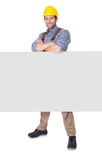 Construction worker presenting empty banner — Stock Photo, Image