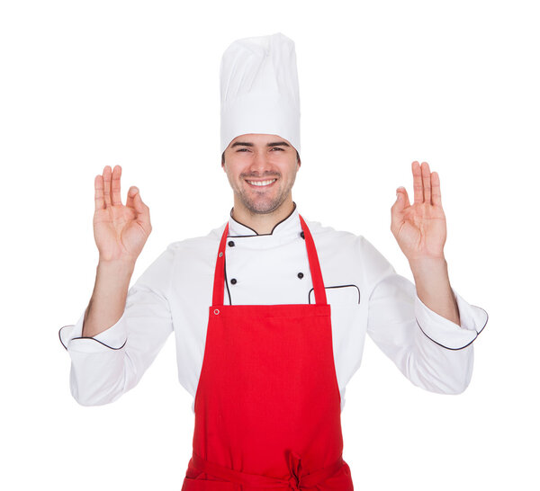 Portrait of cheerful chef in uniform