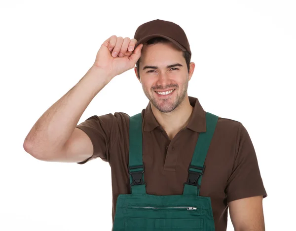 Happy young gardener in dungarees — Stock Photo, Image