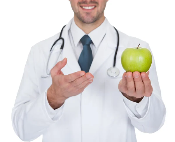 Male Doctor Holding Green Apple — Stock Photo, Image