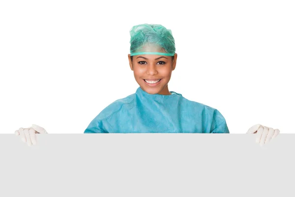 Happy Female Surgeon Holding Placard — Stock Photo, Image