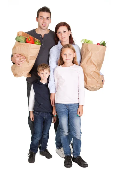 Šťastná rodina s potravinami nákupní tašky — Stock fotografie