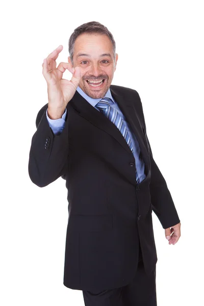 Glad affärsman med tummen upp — Stockfoto