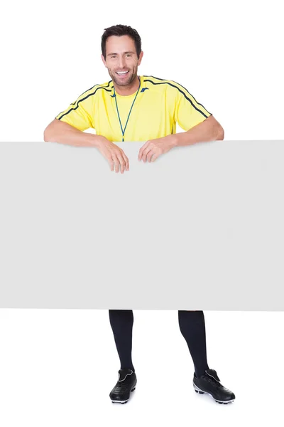 Fußballrichter präsentiert leeres Banner — Stockfoto