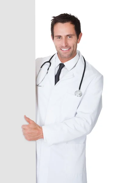 Doctor presenting empty banner — Stock Photo, Image