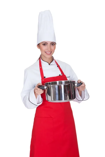 Chef femminile che tiene Utensil — Foto Stock