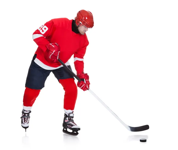 Professional hockey player skating on ice — Stock Photo, Image