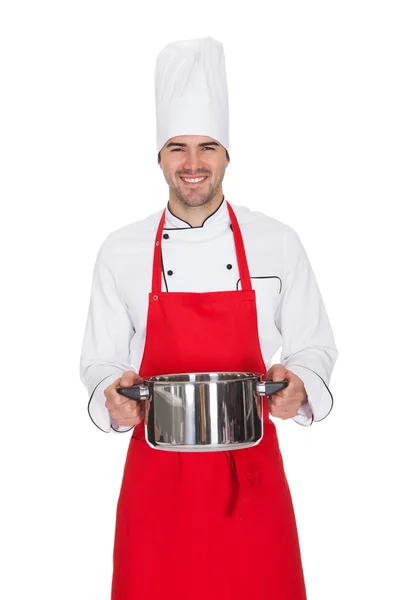 Portret van vrolijke chef-kok die pot — Stockfoto