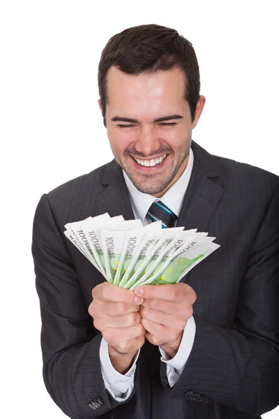 Excited businessman holding euro notes — Stock Photo, Image