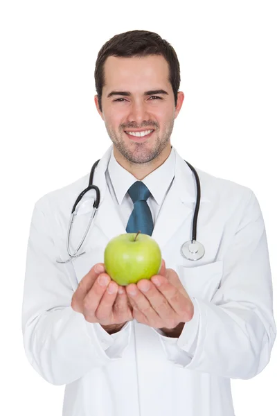 Male Doctor Holding Green Apple — Stock Photo, Image