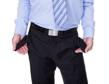 İş adamı boş cepler gösteriyor