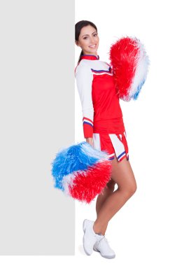 Cheerleader Standing Near Blank Placard
