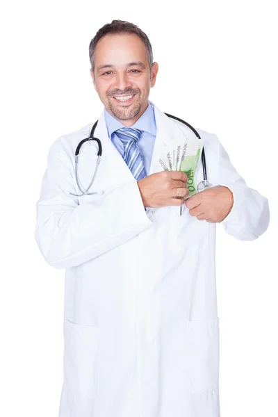 Счастливый доктор держит евроноты — стоковое фото
